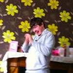 Alex 'stimmimg' in the living room.