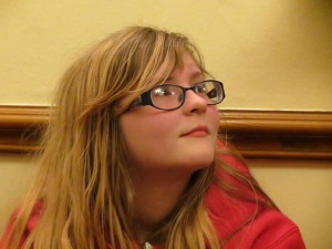 Would you describe my sister as a blond girl or a girl with blond hair?